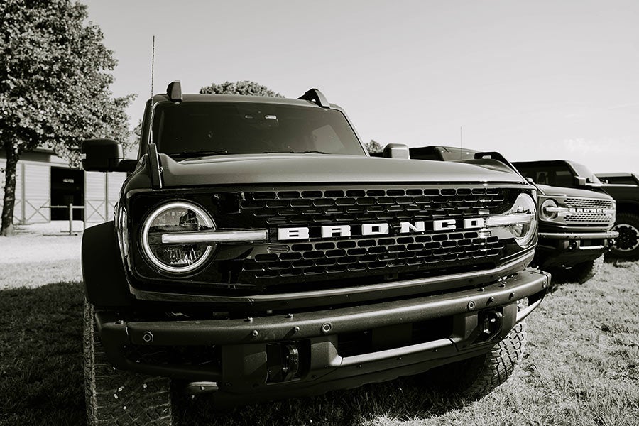 A man and a woman sitting at a table in a rustic building.