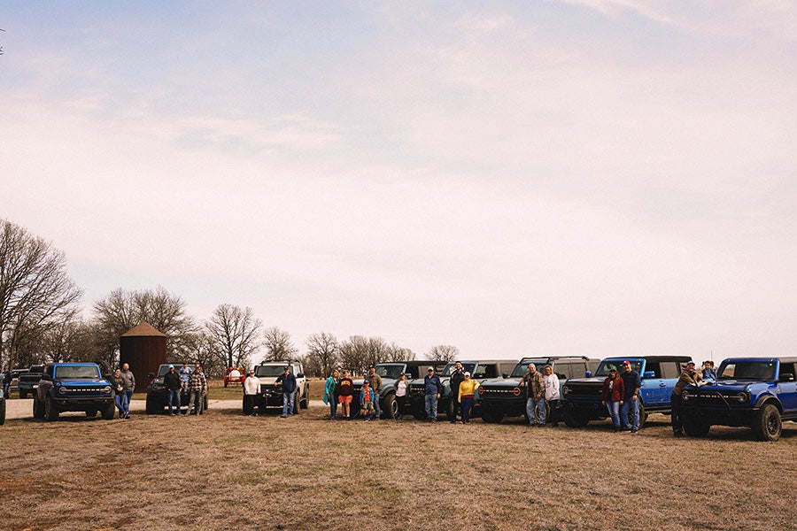 A group of Ford Broncos parked in a row.