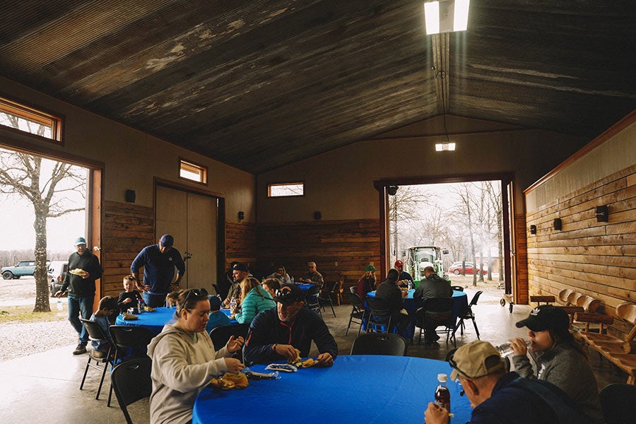 A group of people gathered in a rustic building.