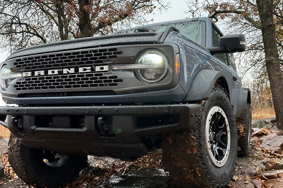 A close-up front view of a gray Ford Bronco.