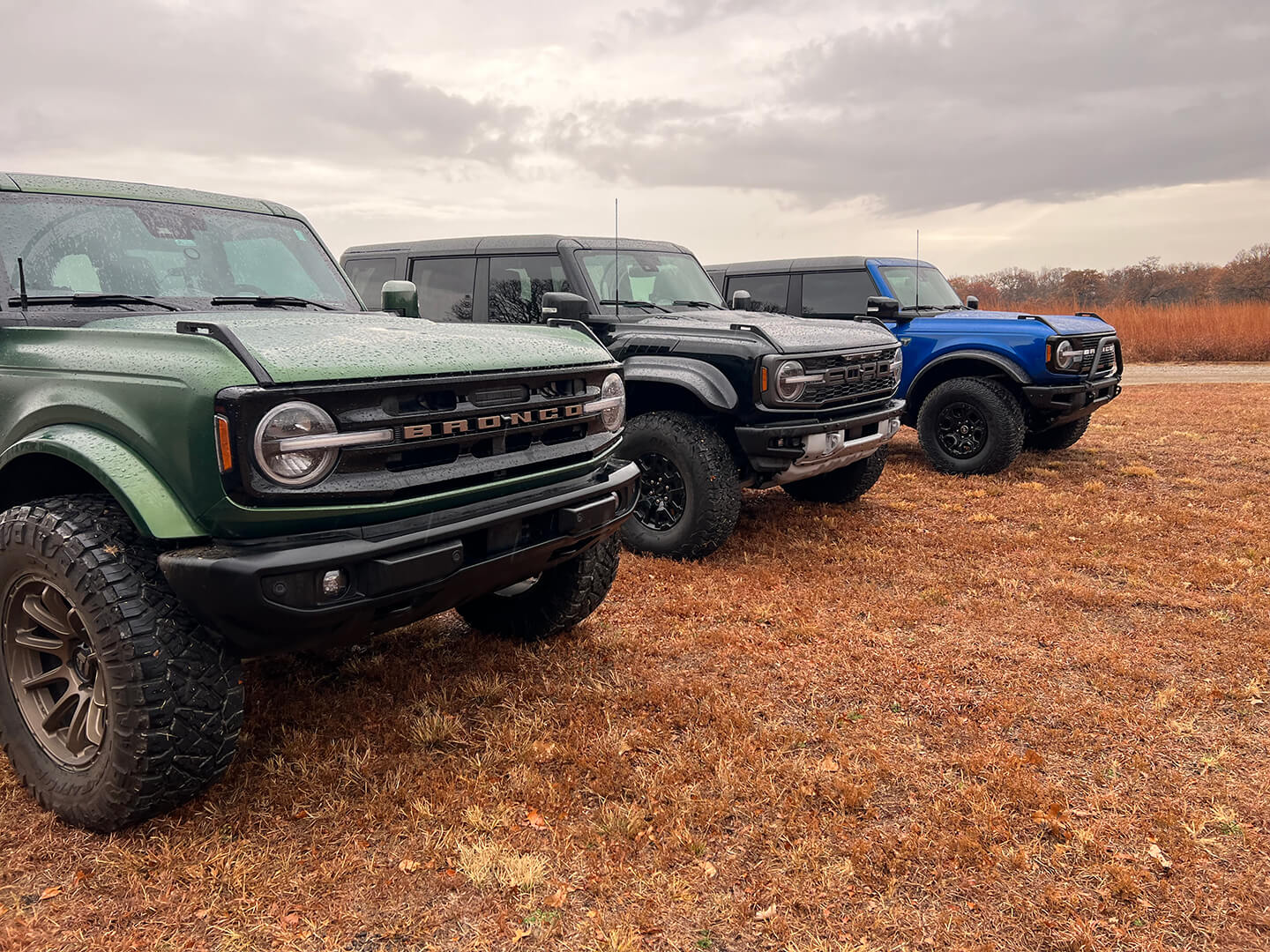  A view of three Ford Broncos parked in a row
