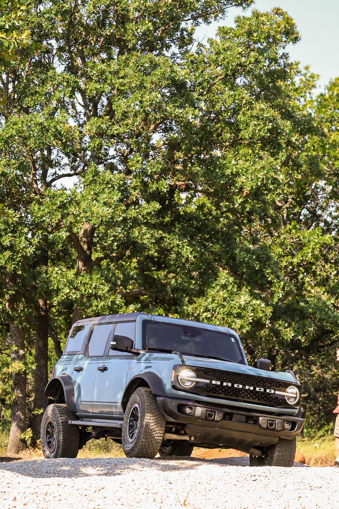A side view of a Ford Bronco from a low angle.